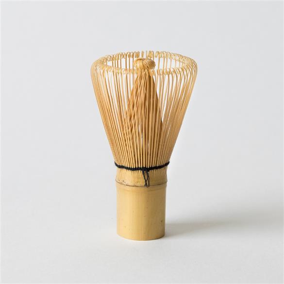 A Bamboo Matcha Tea Whisk by Hangzhou Green Rock Co., Ltd. on a white background.
